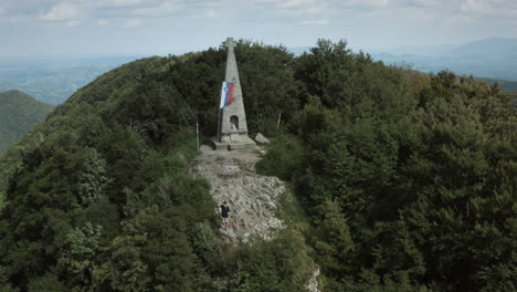 man on the peak of mountain donačka gora walking on rocks