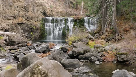 aerial footage of a powerful flowing and tranquil waterfall - middle mccloud falls in northern california