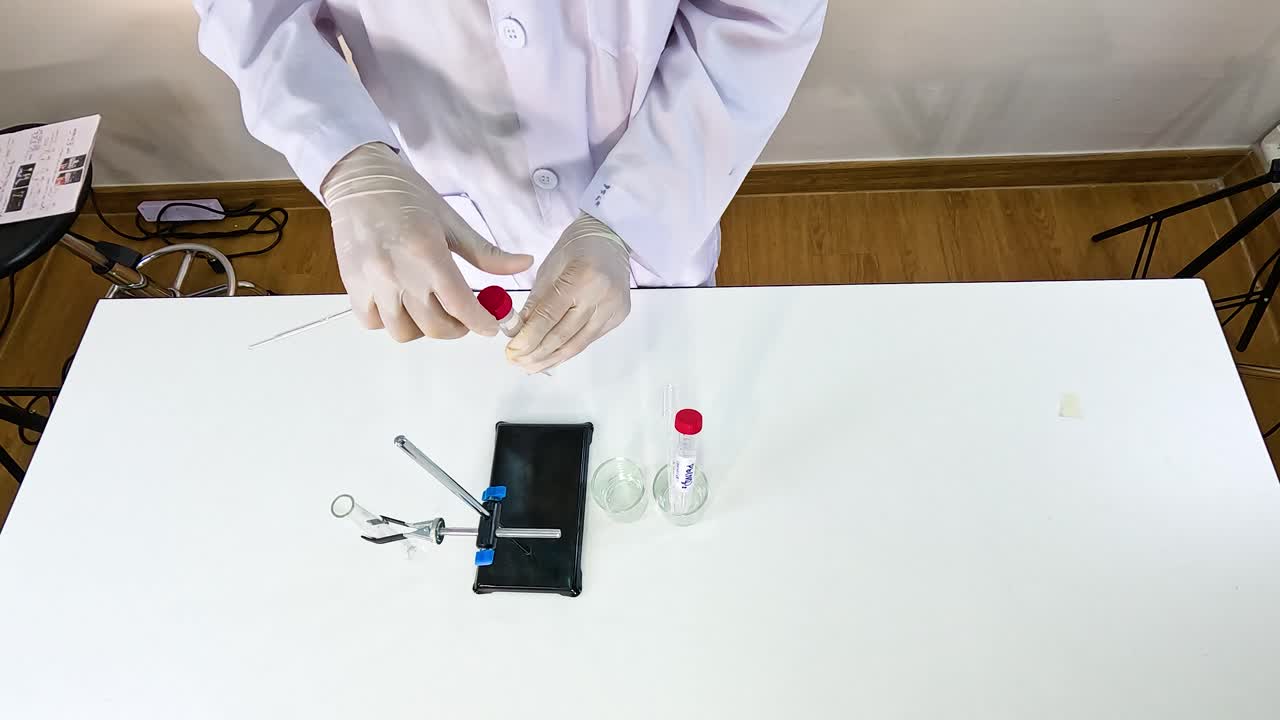 Scientist conducts a chemical reaction with lead nitrate and potassium iodide on a lab table under bright lighting