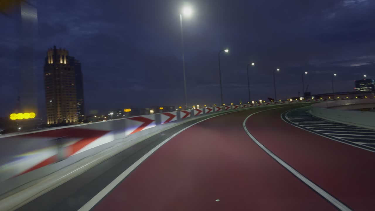 Tokyo Night Drive: Exploring New Territories by Car Discover Tokyo’s new territories at night from the car front view, surrounded by streetlights and the city glow