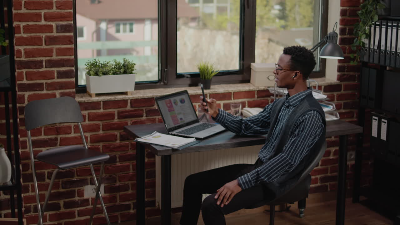 Business man using mobile phone to chat on remote video call