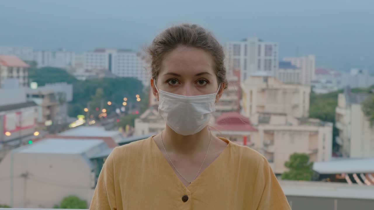 Woman wearing a face mask in a city