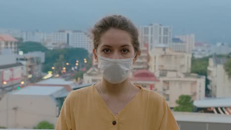 woman wearing a face mask in a city