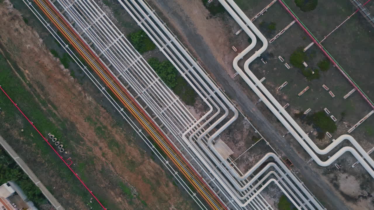 Top view industrial pipeline transporting oil gas. Drone petrochemical pipes