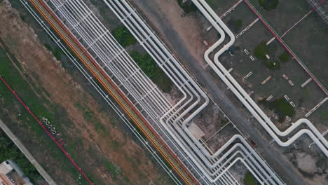 Top view industrial pipeline transporting oil gas. Drone petrochemical pipes
