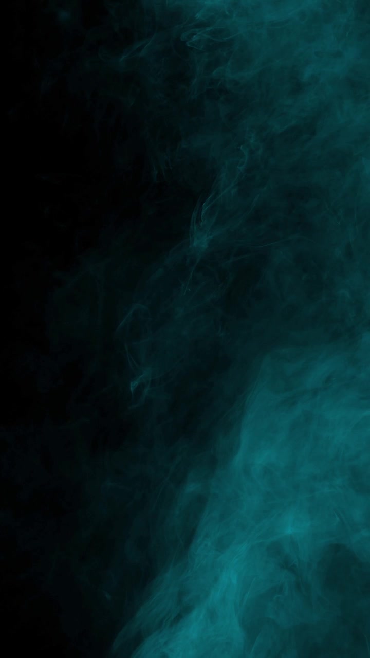 Extremely subtle and faint cyan smoke wisps create dark and moody texture on black background, vertical format