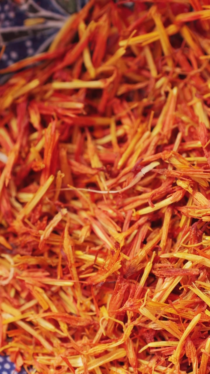 Close-up of Vibrant Saffron Threads in a Decorative Bowl
