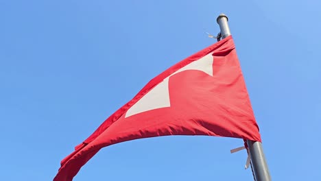 White-cross-emblem-national-Switzerland-flag-hoisted