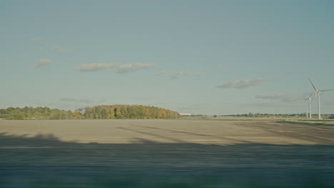 passing windmills and british countryside from a train