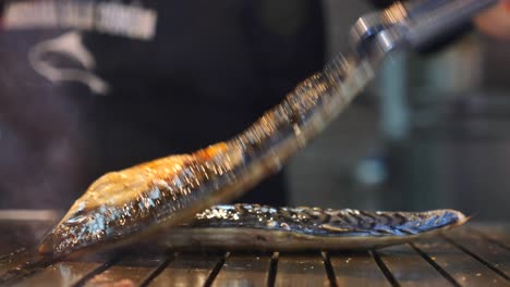 grilled fish being prepared