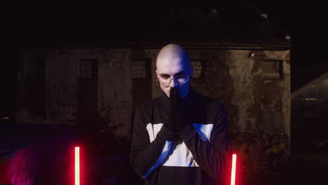 man in stylish clothing at night