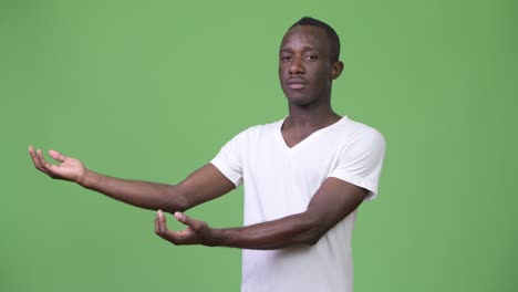 young african man showing something