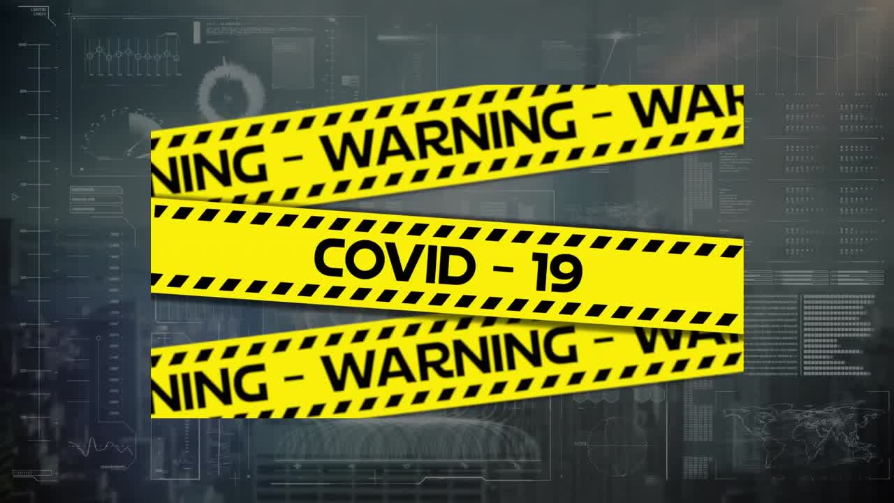 Animation of covid 19 warning text over data processing and cityscape