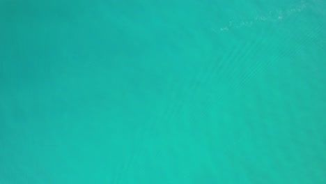 aerial shot of boat driving towards andalusia, spain as skyline comes in focus