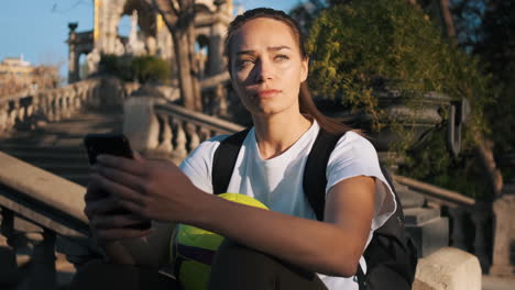 camera zoom out on soccer woman with football in the stairs outdoors.