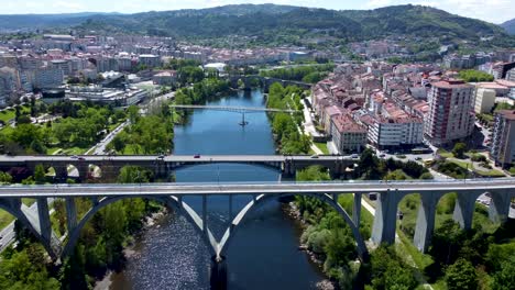 Aerial-of-four-bridges-as-they-cross-the-Miño-river-in-Ourense,-Spain