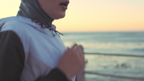 woman running on the beach at sunset