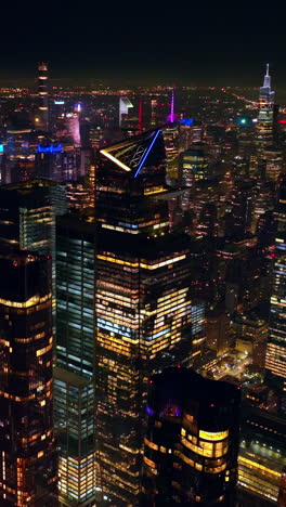 breath-taking view of scenic new york at night. drone footage over the endless panorama of never sleeping metropolis. vertical video