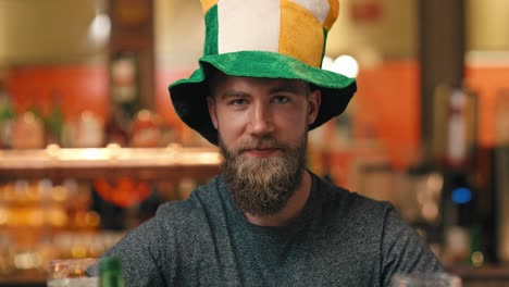 Portrait of man celebrating Saint Patrick&#039;s Day at the bar