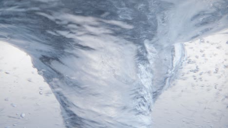 water creating a mesmerizing vortex in a tranquil setting, a stunning natural phenomenon