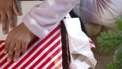 close up of child unwrapping present