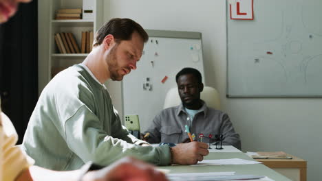 Teacher-and-students-in-driving-school