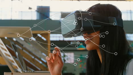 wearing vr headset, woman interacting with animation of network connections