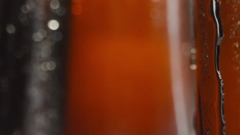 Close-Up-Of-Condensation-Droplets-Running-Down-Bottles-Of-Cold-Beer-Or-Soft-Drinks-1