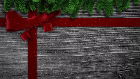 Animation-of-christmas-red-bow-over-wooden-background