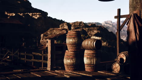 wooden barrels against a mountain range