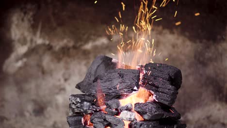 mountain of coal with constant flame coming out of the center