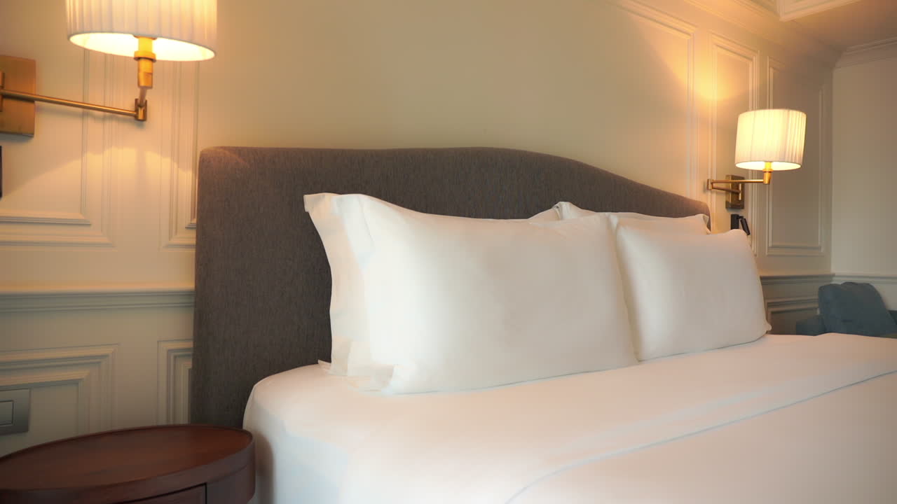 Tilt down on crisp, clean made up resort bed