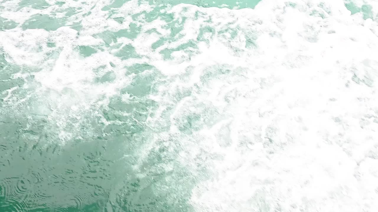 Ocean waves creating white foam in Krabi