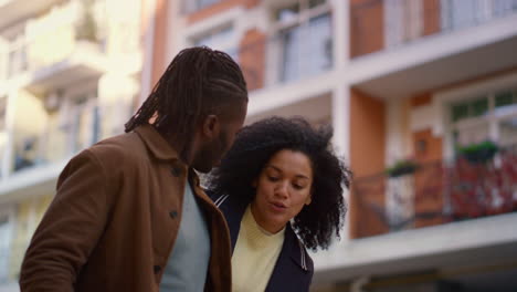 Joyful-couple-walking-talking-about-shopping-portrait.-Happy-weekend-concept.