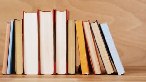 various books arranged in a row