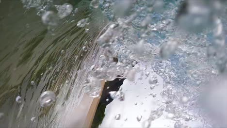 vertical shot of plunging breaker, wave in makua beach, oahu, hawaii