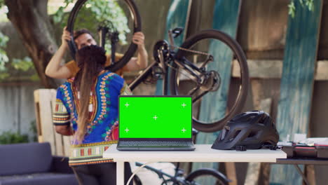 laptop on table with chromakey display