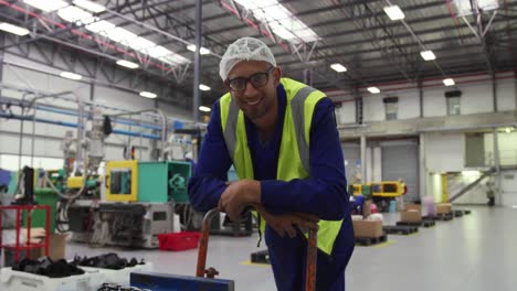 warehouse worker smiling and looking at camera