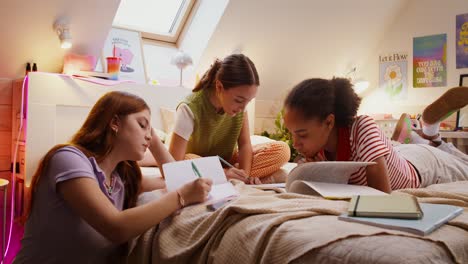 teenage girls studying together in bedroom