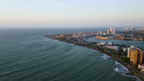 aerial view of cartagena's old town in the distance at sunset