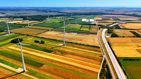 picturesque colorful fields with wind mills. aerial perspective on the countryside used for wind farms