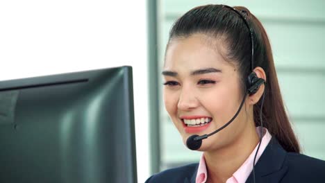 Business-people-wearing-headset-working-in-office