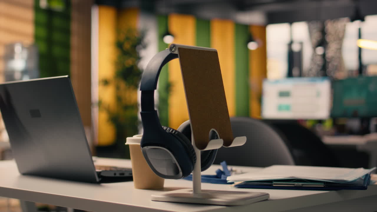 Empty corporate office space with office supplies and laptop at the setup