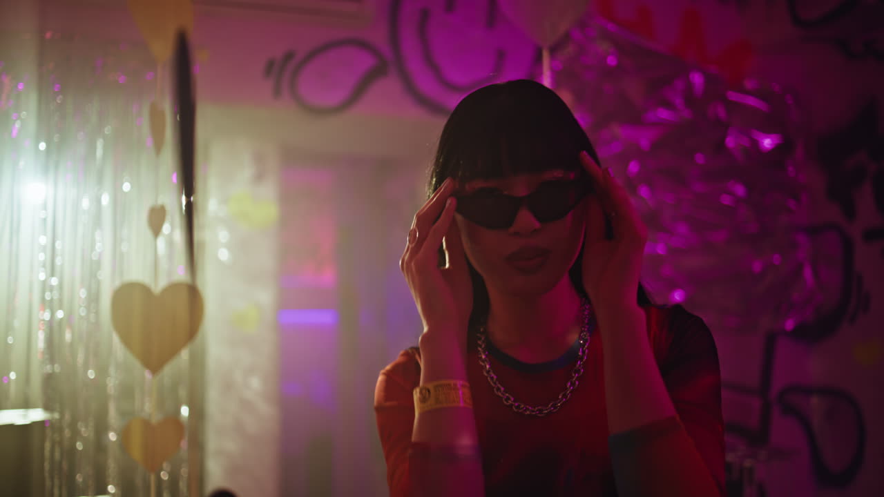 Happy teenager dancing sunglasses at nightclub radiating joyful vibe closeup