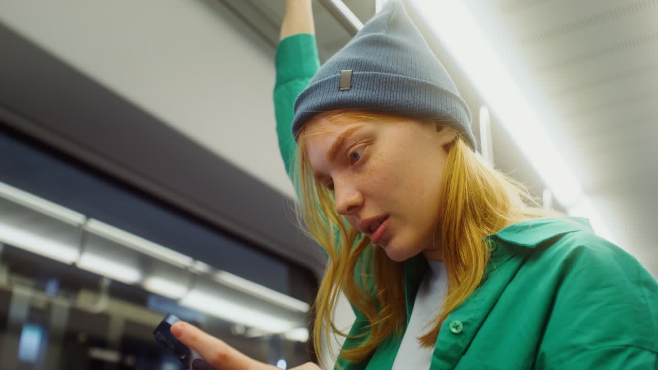 Woman on Subway Using Phone