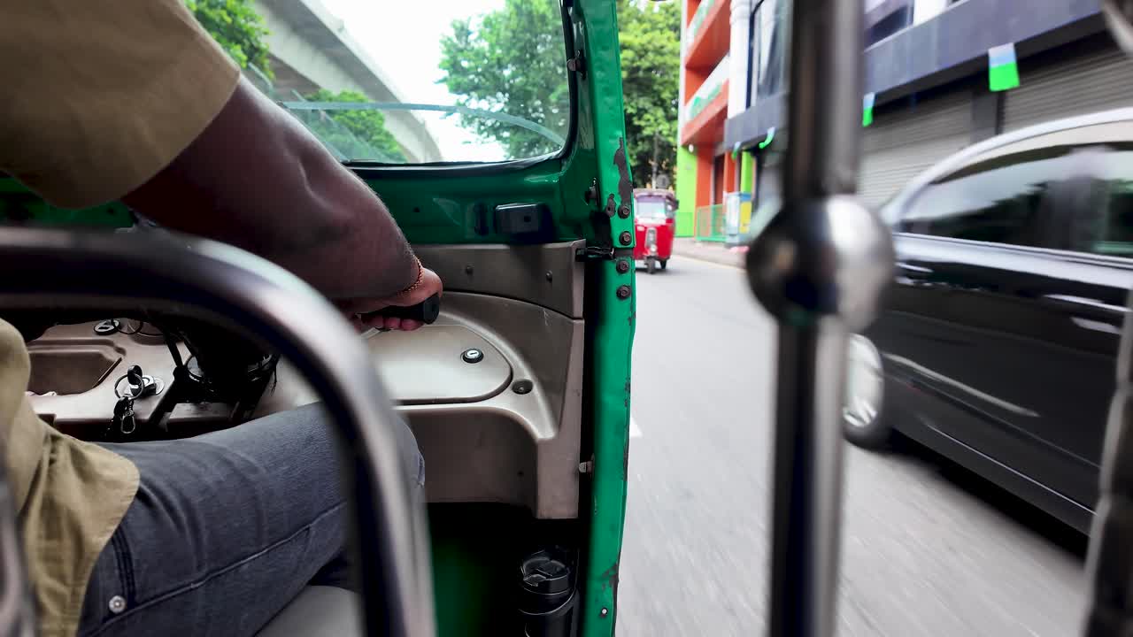 Experience the lively streets of Colombo from a tuk tuk perspective, capturing the essence of Sri Lankan urban life. Discover the vibrant colors and bustling activity of this dynamic city.