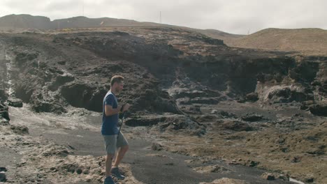 male traveler walking near blowhole