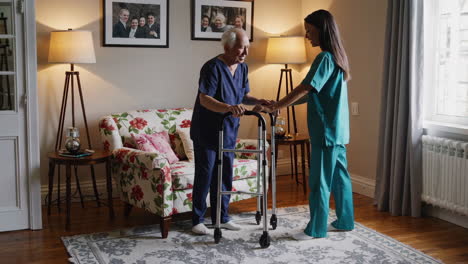 nurse assisting elderly man with walking frame