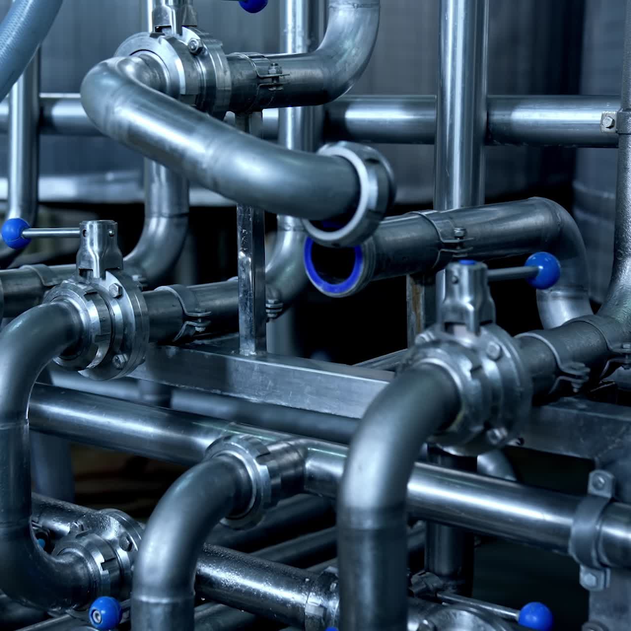 Modern industry for milk production. Stainless pipes inside the food plant. Automated line at milk and cheese manufacture