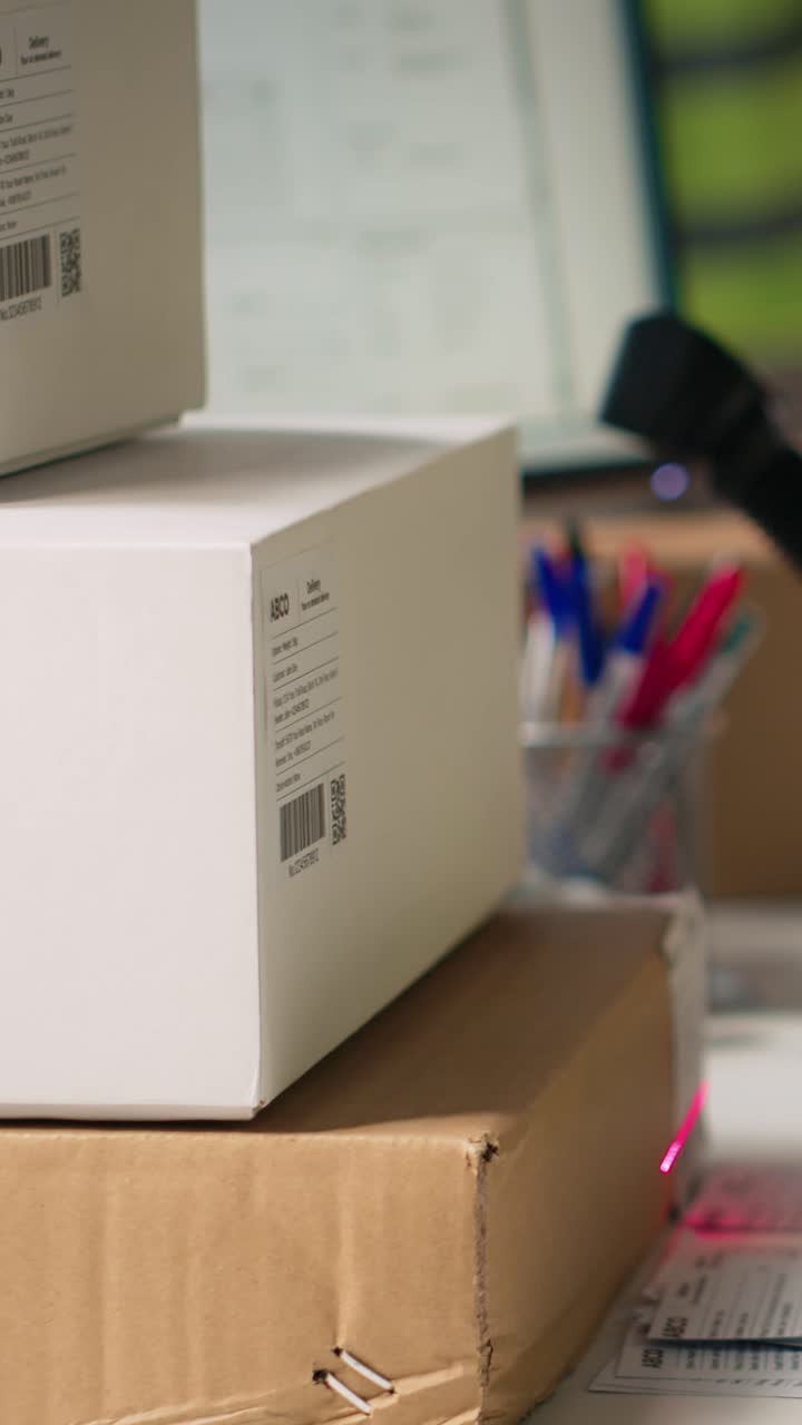 Vertical Video Asian male staff uses handheld scanner to register airway bill information